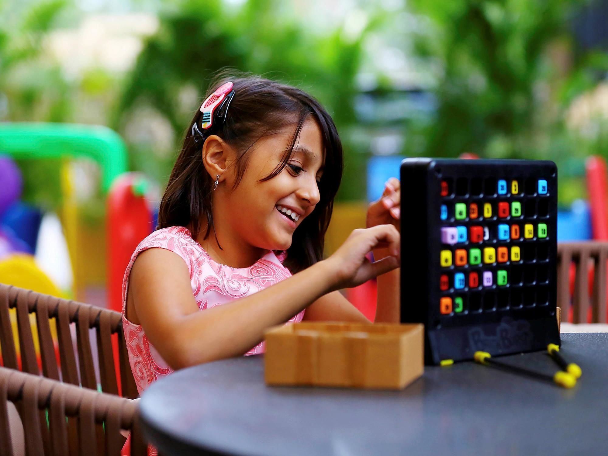 Grand Mercure Mysore - An Accor Brand Exteriör bild A child playing with a tablet